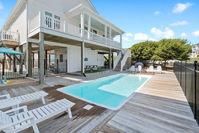 1044 Ocean Blvd W, Supply, NC 28462 - view of pool featuring stairs, a wooden deck, and a patio area