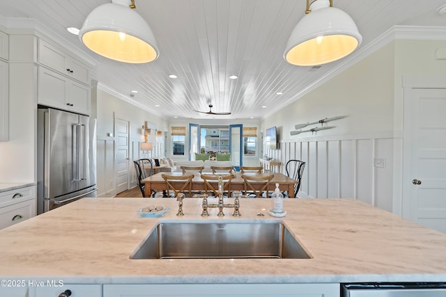 1044 Ocean Blvd W, Supply, NC 28462 - kitchen featuring high quality fridge, open floor plan, a sink, dishwasher, and decorative light fixtures