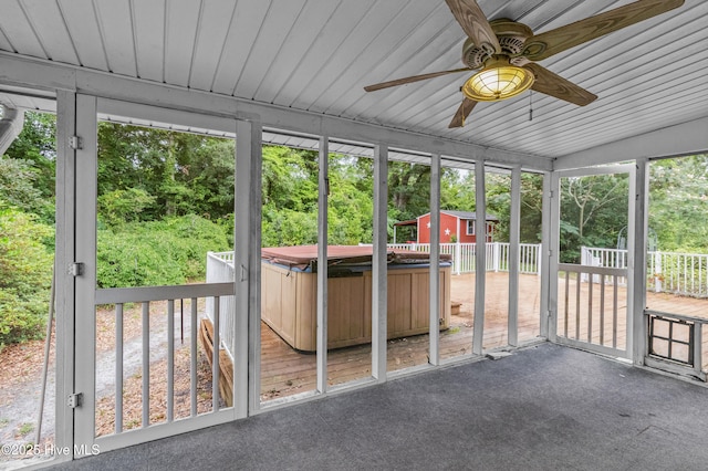 350 Toulon Dr, Wilmington, NC 28405 - unfurnished sunroom featuring a jacuzzi, ceiling fan, and view of wooded area