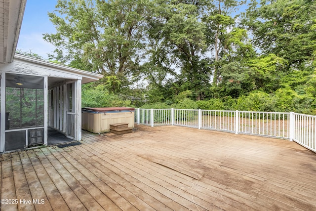 350 Toulon Dr, Wilmington, NC 28405 - deck with a hot tub, a sunroom, and view of scattered trees