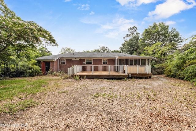 350 Toulon Dr, Wilmington, NC 28405 - back of property featuring brick siding, a sunroom, and a wooden deck