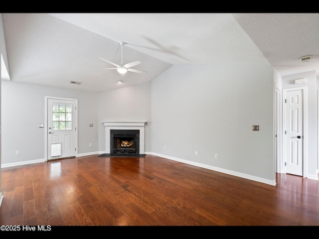406 Endicott Ct, Wilmington, NC 28411 - unfurnished living room featuring ceiling fan, vaulted ceiling, wood finished floors, a fireplace with flush hearth, and baseboards