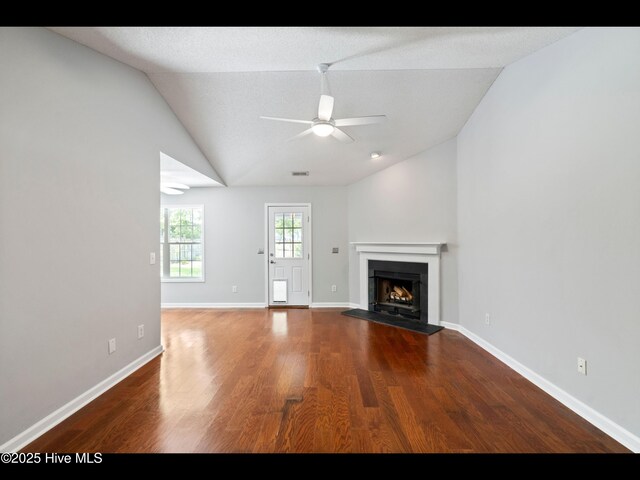 406 Endicott Ct, Wilmington, NC 28411 - unfurnished living room featuring ceiling fan, lofted ceiling, a fireplace, wood finished floors, and baseboards