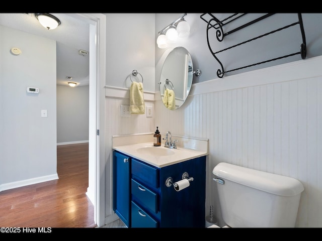 406 Endicott Ct, Wilmington, NC 28411 - half bath with wood finished floors, vanity, toilet, and baseboards