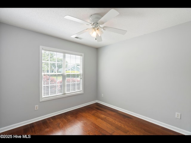 406 Endicott Ct, Wilmington, NC 28411 - spare room with dark wood-type flooring, a ceiling fan, and baseboards