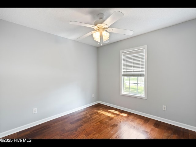 406 Endicott Ct, Wilmington, NC 28411 - spare room with dark wood-type flooring, baseboards, and a ceiling fan