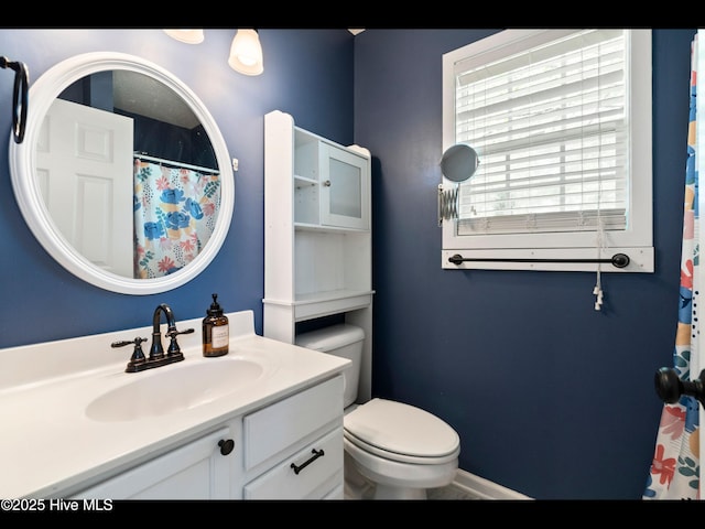 406 Endicott Ct, Wilmington, NC 28411 - bathroom featuring vanity, toilet, curtained shower, and baseboards