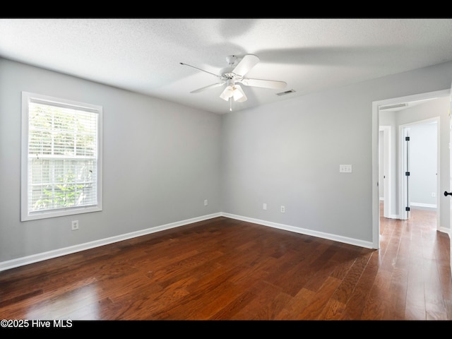 406 Endicott Ct, Wilmington, NC 28411 - unfurnished room featuring dark wood-style floors, a ceiling fan, and baseboards