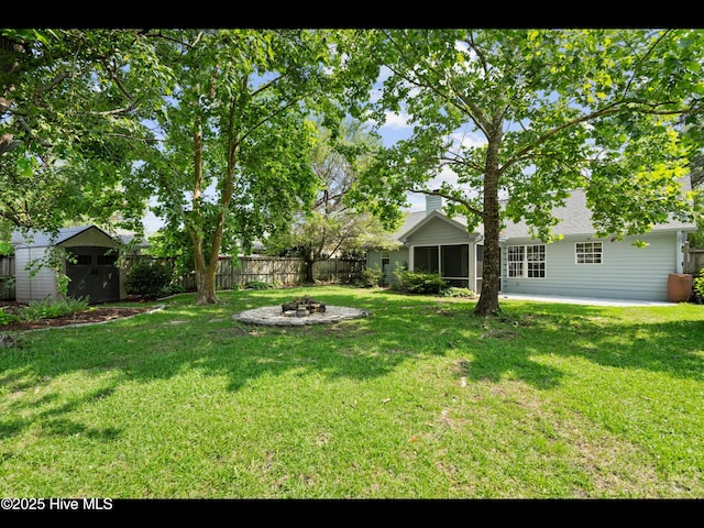 406 Endicott Ct, Wilmington, NC 28411 - view of yard featuring an outdoor fire pit, a sunroom, and a patio