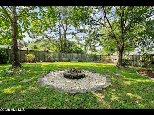 406 Endicott Ct, Wilmington, NC 28411 - view of yard featuring an outdoor fire pit