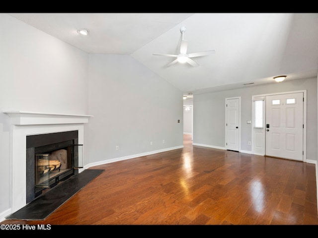 406 Endicott Ct, Wilmington, NC 28411 - unfurnished living room featuring a ceiling fan, a glass covered fireplace, vaulted ceiling, wood finished floors, and baseboards