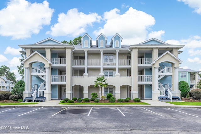 330 S Middleton Dr NW Unit 1201, Calabash, NC 28467 - view of property featuring uncovered parking and stairway