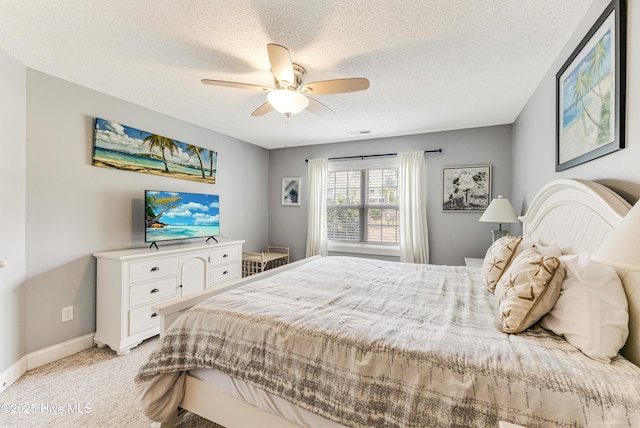 330 S Middleton Dr NW Unit 1201, Calabash, NC 28467 - bedroom featuring a textured ceiling, light colored carpet, baseboards, and a ceiling fan