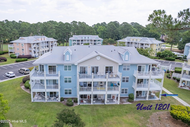 330 S Middleton Dr NW Unit 1201, Calabash, NC 28467 - rear view of property with a lawn