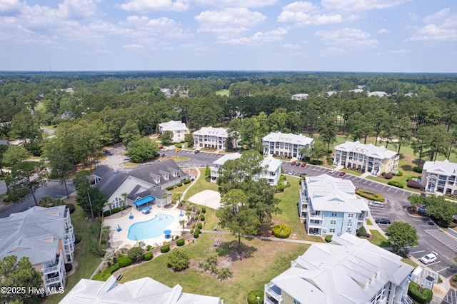 330 S Middleton Dr NW Unit 1201, Calabash, NC 28467 - drone / aerial view of a pool area and a forest