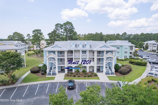 330 S Middleton Dr NW Unit 1201, Calabash, NC 28467 - view of property featuring uncovered parking and a residential view