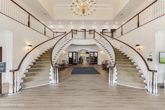 330 S Middleton Dr NW Unit 1201, Calabash, NC 28467 - entrance foyer featuring a towering ceiling, stairway, a chandelier, crown molding, and a tray ceiling