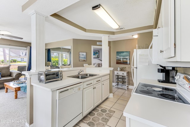 330 S Middleton Dr NW Unit 1201, Calabash, NC 28467 - kitchen featuring ornate columns, white appliances, a sink, open floor plan, and a textured ceiling