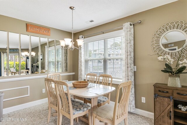 330 S Middleton Dr NW Unit 1201, Calabash, NC 28467 - dining space featuring a chandelier and baseboards