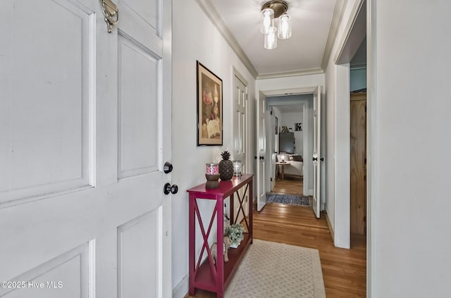 1409 Knollwood Dr NW, Wilson, NC 27896 - hall with light wood-style flooring and crown molding
