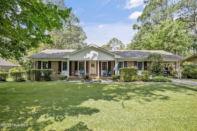 1409 Knollwood Dr NW, Wilson, NC 27896 - single story home featuring a porch, brick siding, a chimney, and a front yard
