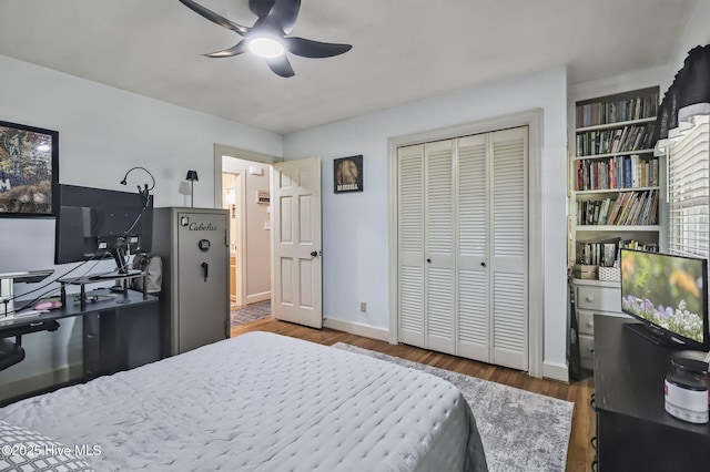 1409 Knollwood Dr NW, Wilson, NC 27896 - bedroom featuring wood finished floors, baseboards, a closet, and ceiling fan