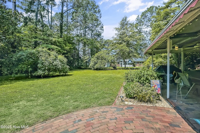 1409 Knollwood Dr NW, Wilson, NC 27896 - view of grassy yard with a patio area