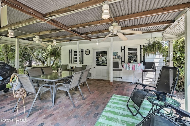 1409 Knollwood Dr NW, Wilson, NC 27896 - view of patio with a ceiling fan and outdoor dining space