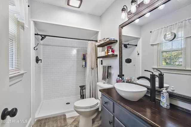 1409 Knollwood Dr NW, Wilson, NC 27896 - bathroom featuring toilet, vanity, and tiled shower