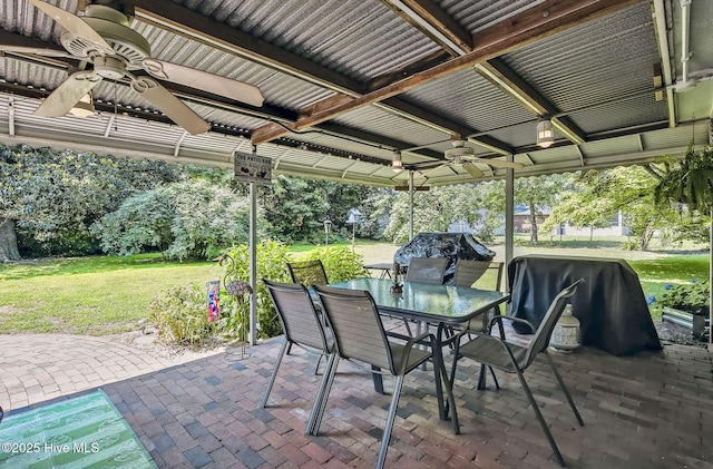 1409 Knollwood Dr NW, Wilson, NC 27896 - view of patio with a ceiling fan, outdoor dining space, and a grill