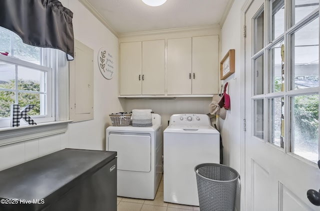 1409 Knollwood Dr NW, Wilson, NC 27896 - laundry area with cabinet space, washer and dryer, light tile patterned floors, ornamental molding, and a textured ceiling