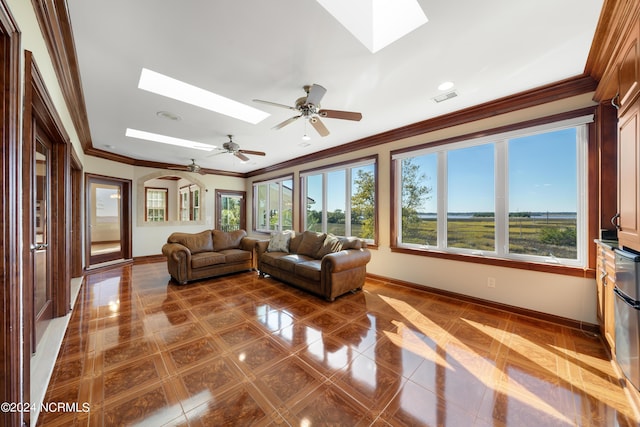 6424 River Vista Dr, Wilmington, NC 28412 - living room with a skylight, baseboards, crown molding, plenty of natural light, and recessed lighting