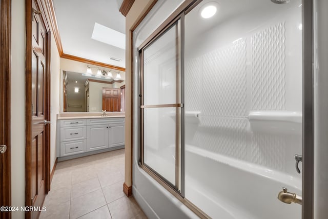6424 River Vista Dr, Wilmington, NC 28412 - full bathroom featuring combined bath / shower with glass door, vanity, tile patterned floors, and a skylight