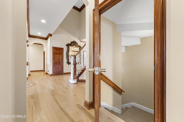 6424 River Vista Dr, Wilmington, NC 28412 - hall featuring light wood-style flooring, baseboards, crown molding, stairway, and recessed lighting