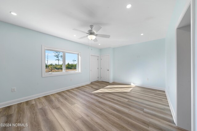 6424 River Vista Dr, Wilmington, NC 28412 - unfurnished bedroom featuring baseboards, light wood-style floors, recessed lighting, and a ceiling fan