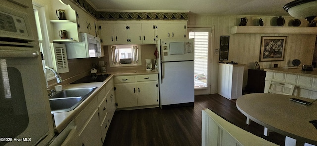301 Graham St, Clinton, NC 28328 - kitchen featuring white appliances, a sink, white cabinets, dark wood-style flooring, and open shelves