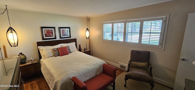301 Graham St, Clinton, NC 28328 - bedroom featuring wood finished floors, ornamental molding, and baseboards