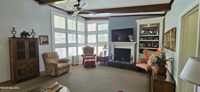 301 Graham St, Clinton, NC 28328 - living room featuring beamed ceiling, a ceiling fan, carpet floors, and a fireplace with raised hearth