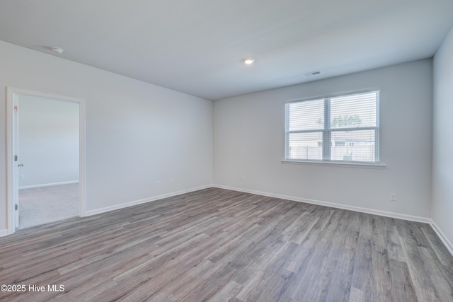5380 Black Oak Ct, Winnabow, NC 28479 - empty room with wood finished floors and a smoke detector