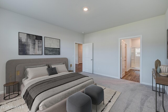 5380 Black Oak Ct, Winnabow, NC 28479 - carpeted bedroom with baseboards and ensuite bathroom