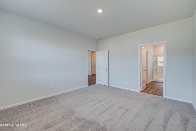 5380 Black Oak Ct, Winnabow, NC 28479 - unfurnished bedroom featuring carpet floors and connected bathroom