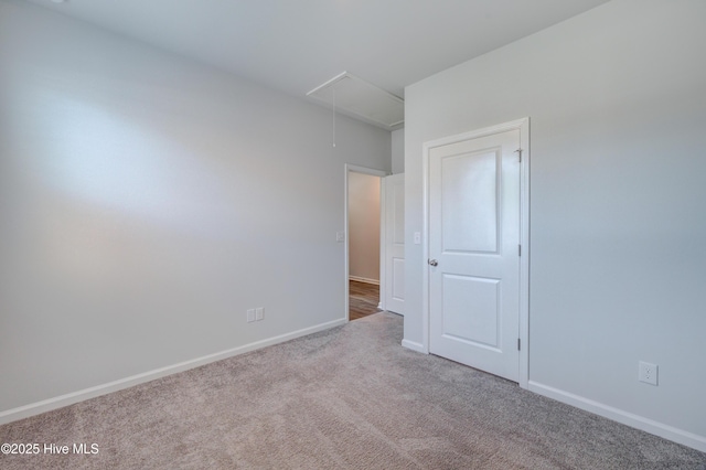 5380 Black Oak Ct, Winnabow, NC 28479 - unfurnished bedroom featuring attic access and carpet