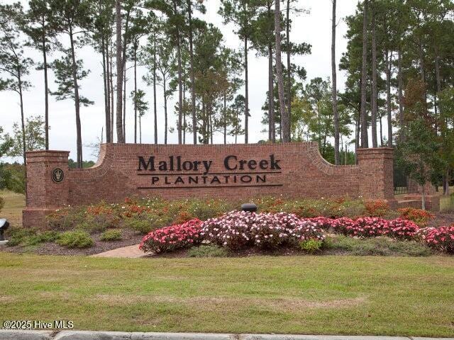 5380 Black Oak Ct, Winnabow, NC 28479 - community sign with a lawn