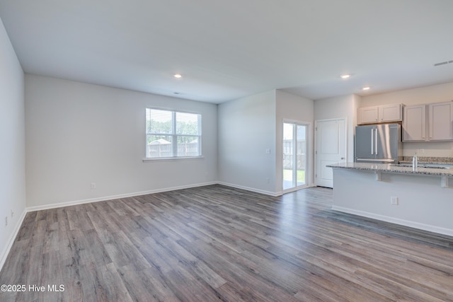 5380 Black Oak Ct, Winnabow, NC 28479 - unfurnished living room with wood finished floors and recessed lighting
