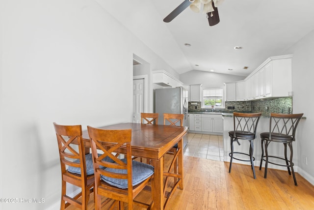 126 NE 5th St, Oak Island, NC 28465 - dining space with lofted ceiling, a ceiling fan, recessed lighting, and light wood finished floors