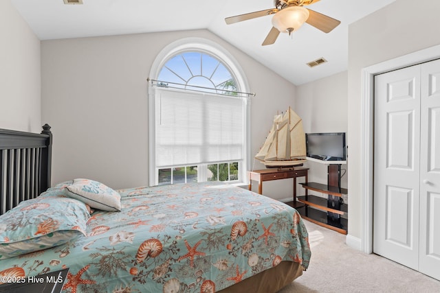 126 NE 5th St, Oak Island, NC 28465 - bedroom with vaulted ceiling, carpet floors, multiple windows, a ceiling fan, and a closet