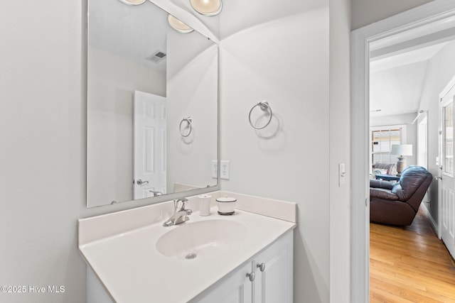 126 NE 5th St, Oak Island, NC 28465 - bathroom with vanity, wood finished floors, and baseboards