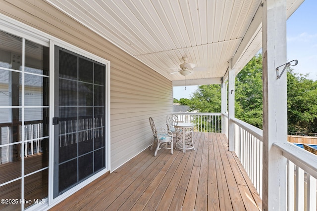 126 NE 5th St, Oak Island, NC 28465 - wooden deck with a ceiling fan