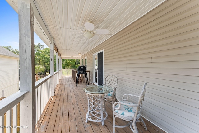 126 NE 5th St, Oak Island, NC 28465 - wooden terrace with ceiling fan