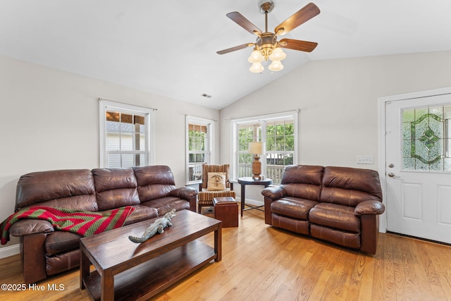 126 NE 5th St, Oak Island, NC 28465 - living room featuring a ceiling fan, light wood-style flooring, and vaulted ceiling